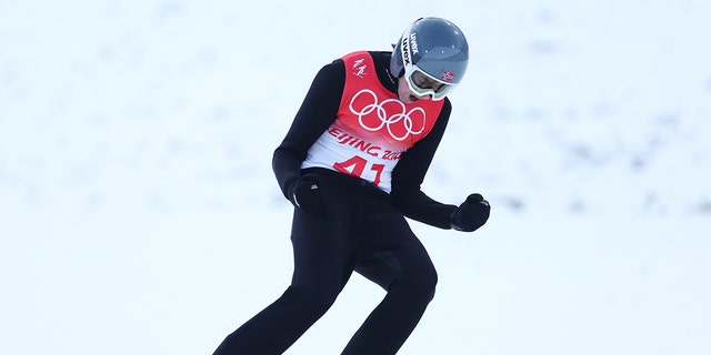 Team Norway's Jarl Magnus Reber celebrates competition during the Gundersen Hill Singles/10km Ski Jump competition round on day 11 of the 2022 Beijing Winter Olympics at the National Cross-Country Ski Center on February 15, 2022 in Zhangjiakou, China. 