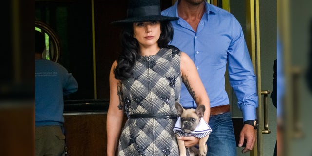 Lady Gaga is seen leaving her apartment with her dog Koji on May 12, 2015 in New York City. 