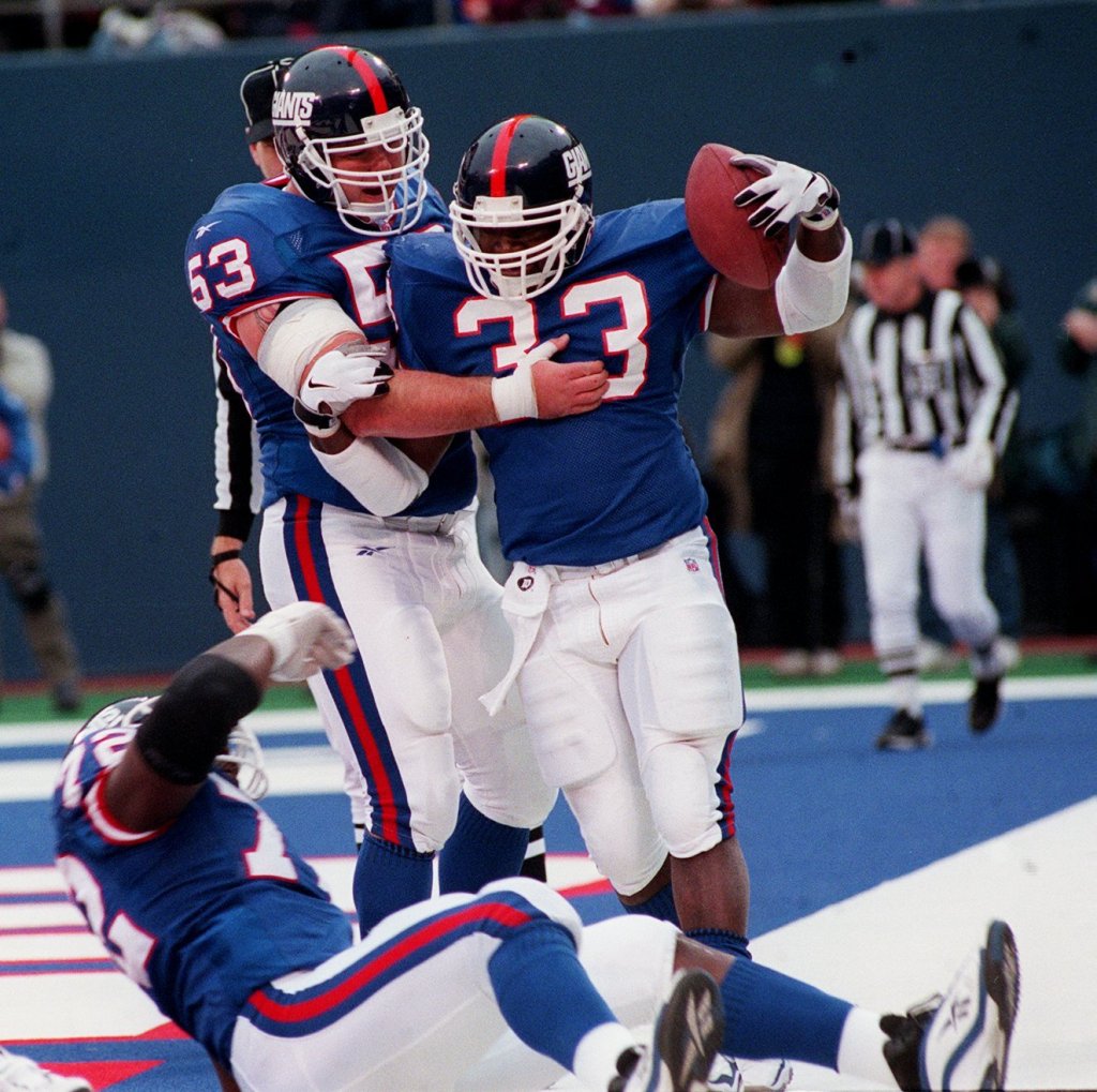 Gary Brown celebrates with #53 Lance Scott after scoring against the Chiefs in 1998.
