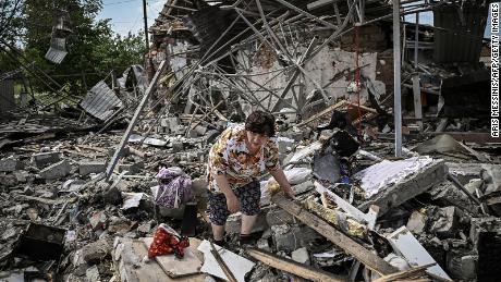 Residents search for belongings under the rubble of their homes after an attack destroyed three homes in the city of Slovensk in the Donbass region of eastern Ukraine on June 1.