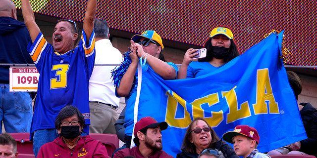 UCLA Bruins fans cheer at the Los Angeles Memorial Coliseum in Los Angeles on November 20, 2021.