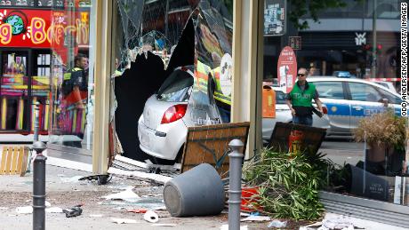 A police spokesman said the driver was arrested after storming a storefront on a busy street in Berlin's Charlottenburg district.