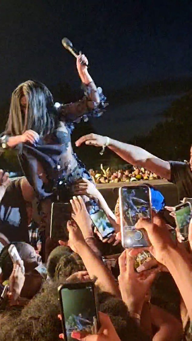 Swinging: Cardi B appears to have had a brawl over the weekend at the Wireless Festival in London.  The WAP beat maker is seen on a video showing him swiping down on someone in the crowd with her microphone
