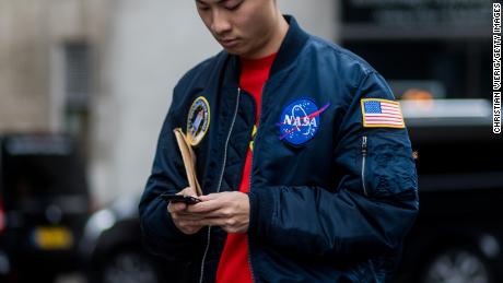A guest wears a NASA bomber jacket during London Fashion Week men's collections at Matthew Miller on January 7, 2017 in London, England.