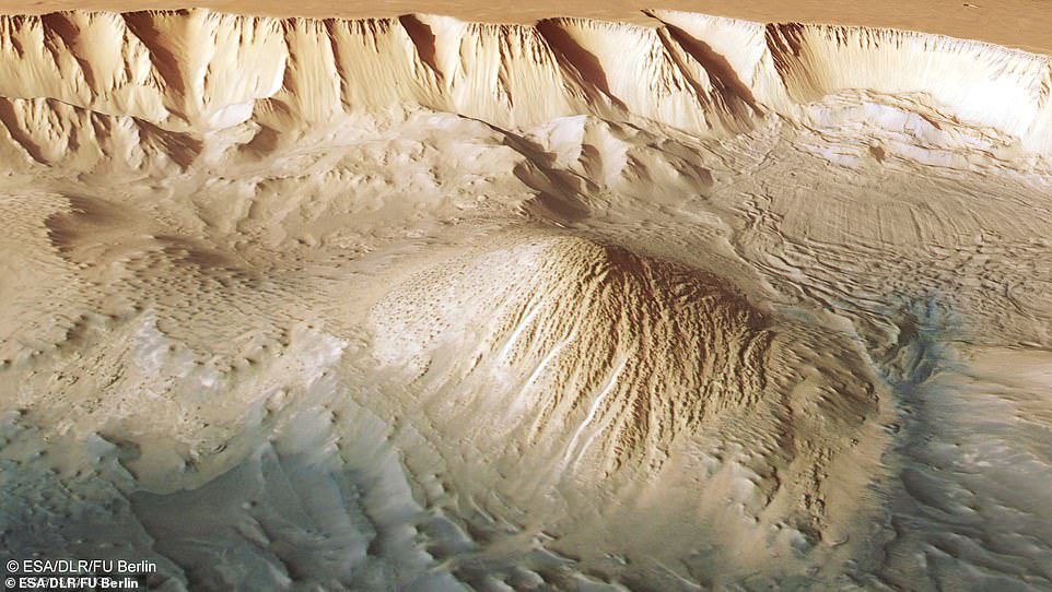 This image of Tethonium Chasma shows parallel lines and debris piles (top right) indicating a recent landslide.
