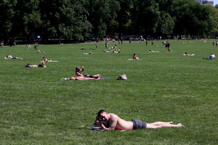 New Yorkers sunbathe in Central Park
