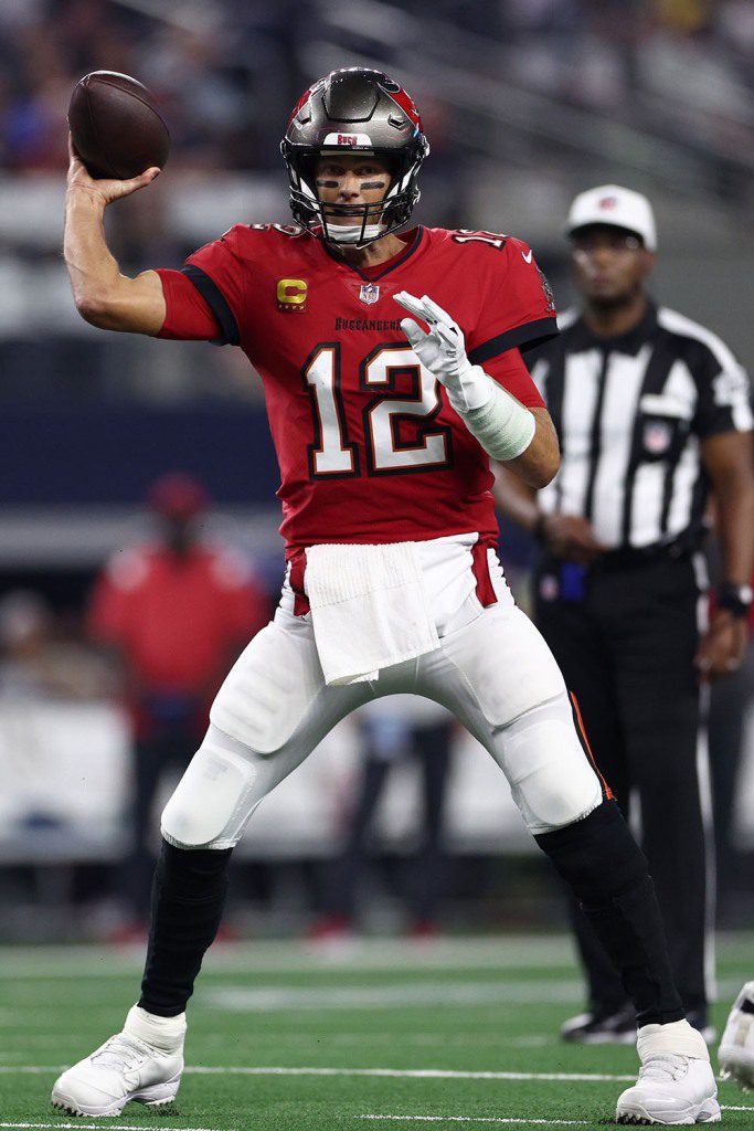 Tom Brady of the Tampa Bay Buccaneers makes a pass against the Dallas Cowboys during the first half at AT&T Stadium on September 11, 2022 in Arlington, Texas. 