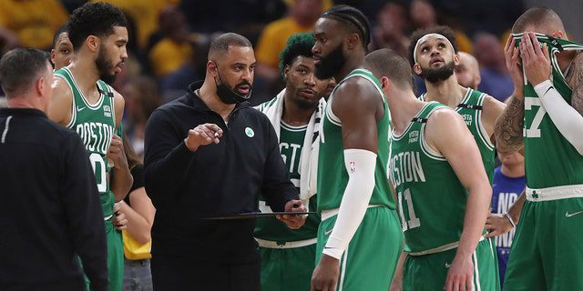 Boston Celtics coach Im Odoka, center left, talks with players during the first half of Game Two of the NBA Finals against the Golden State Warriors in San Francisco, Sunday, June 5, 2022.