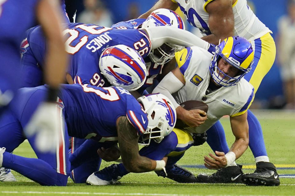 It wasn't a fun night for Matthew Stafford (right) and the Rams' offense against the bills.  (AP Photo/Ashley Landis)