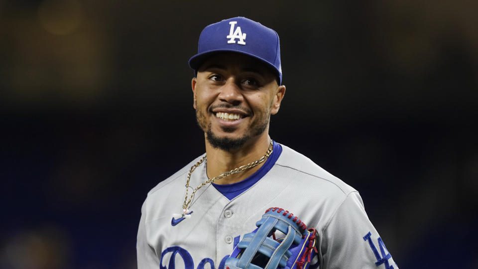 Los Angeles Dodgers right-hander Mookie Betts (50) runs across the field during a baseball game against the Miami Marlins, Friday, August 26, 2022, in Miami.  (AP Photo/Marta Lavandier)