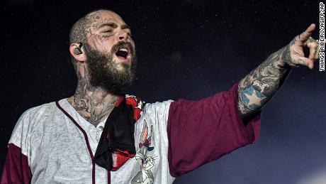 Post Malone suffers bruised ribs after falling from a hole on stage in St. Louis