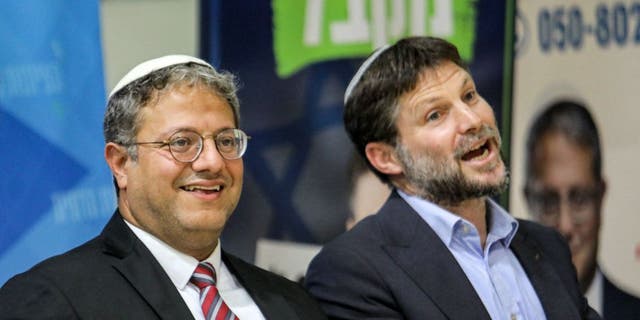 Itamar Ben Gvir, left, and Bezalel Smotrich attend a mass rally with his supporters in the southern Israeli city of Sderot on October 26, 2022.