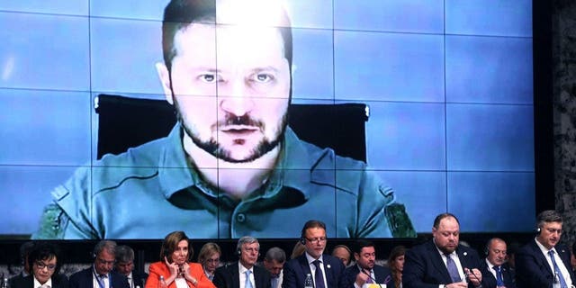 Ukrainian President Volodymyr Zelensky speaks via video link to the opening session of the Parliamentary Summit of the International Crimea Platform, organized by Ukraine and Croatia, in Zagreb, on October 25, 2022.