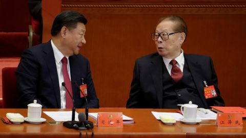 Chinese leader Xi Jinping speaks with former leader Jiang Zemin during the National Congress of the Communist Party in Beijing on October 24, 2017. 