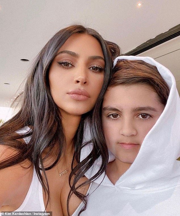 Flashback: Kim and Mason posing together in a throwback photo